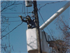 Person in bucket working on power line